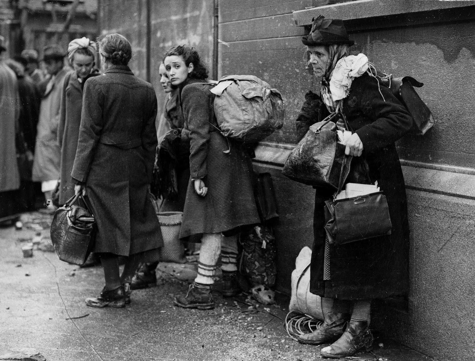 German civilian refugees prepare to flee war-torn Aachen, Germany as the battle for the doomed city draws to a close, Oct. 24, 1944.