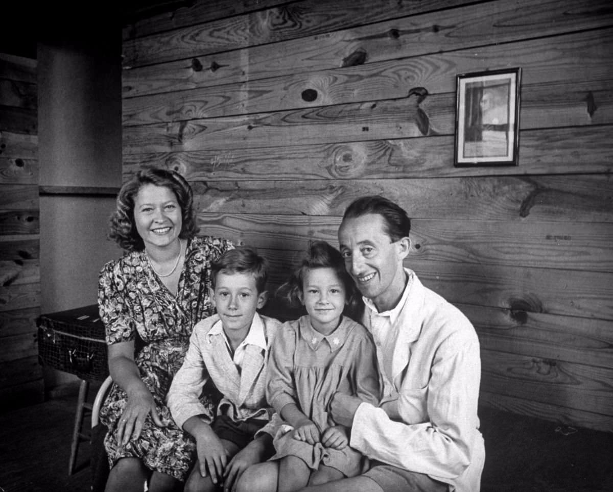 The Albrecht family in their new barracks home. He is Jewish, she is Catholic. Their children are Peter, 10, and Renata, 5. Before war, he operated a theater in Vienna. In 1939 he went to Italy, was followed later by his wife and children.