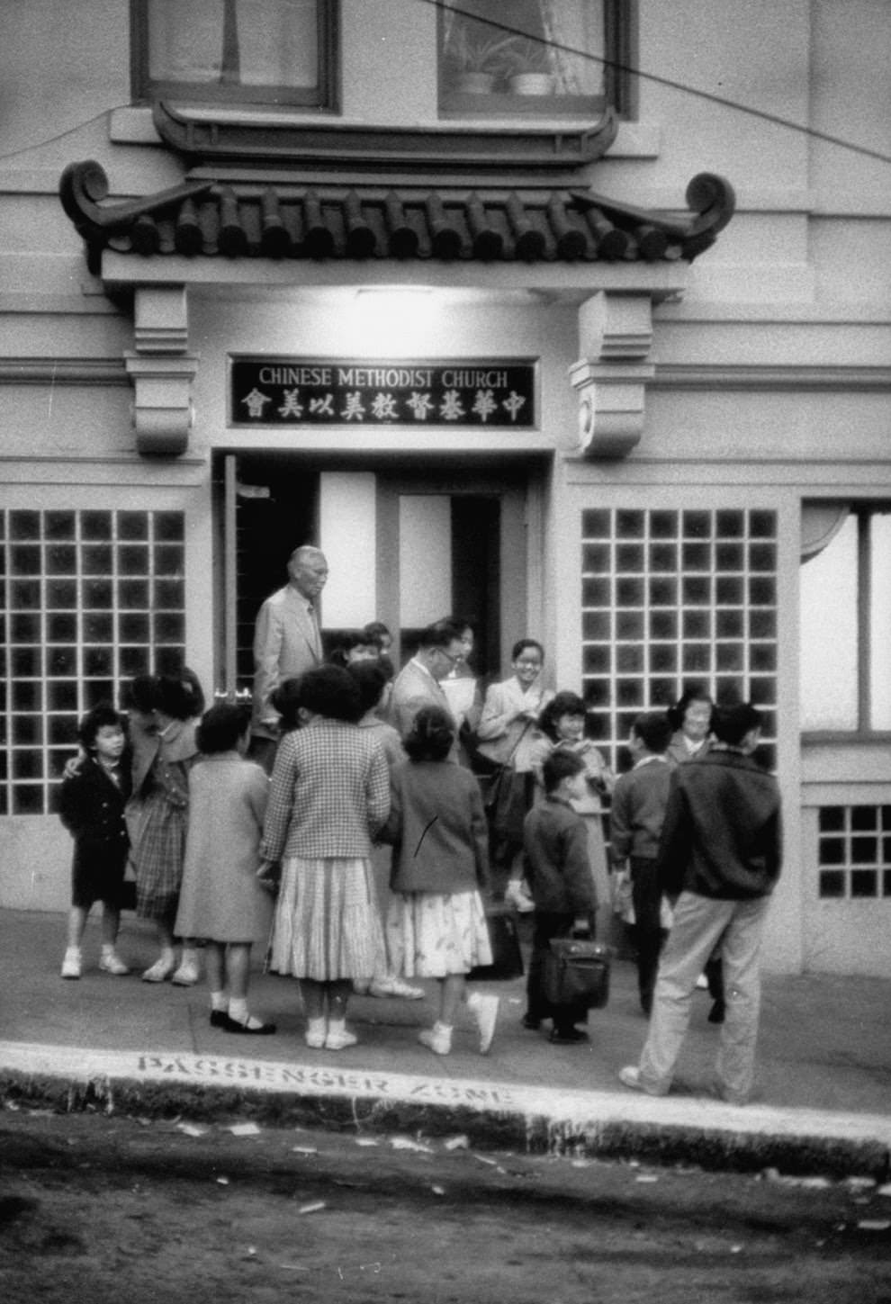 Parents greet their children after they finish school for the day.