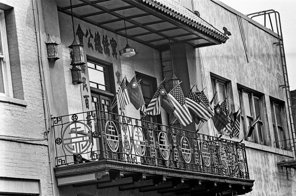 Nationalist Chinese and American flags wave side by side.