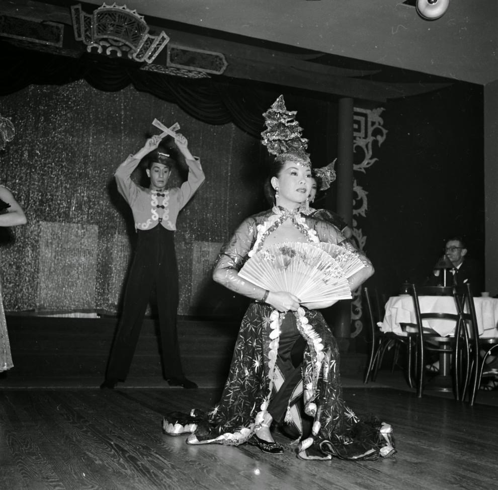 Chinese dancers perform an elaborate floor show.