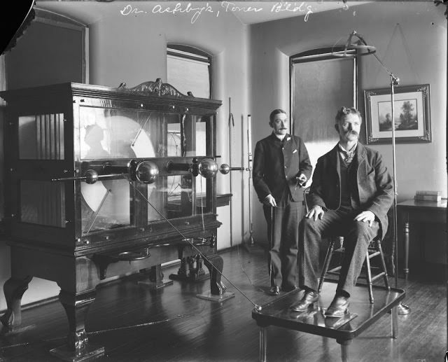 Two doctors show off the large electro-shock machine at St. Elizabeths Hospital in Washington, D.C. in 1923.