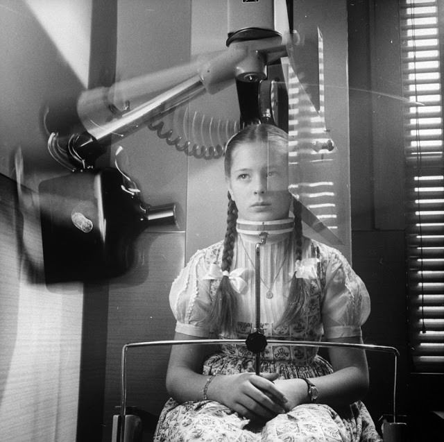 X-ray machine which circles head to take panoramic picture of teeth, eliminating usual mouthful of film, 1960.