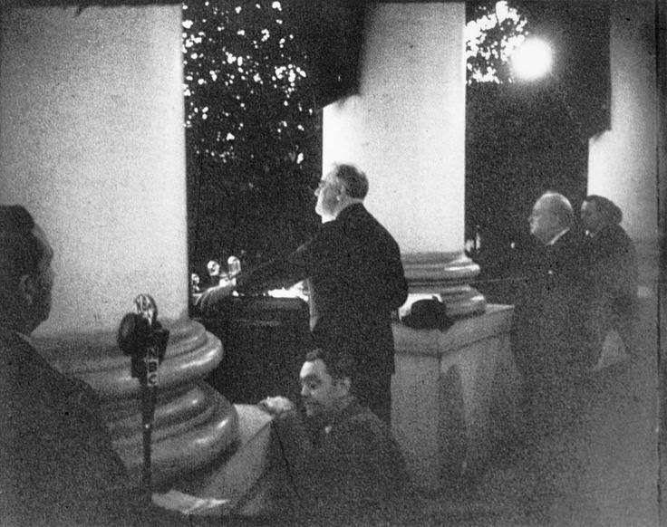 Roosevelt addresses the crowd at the Christmas tree lighting ceremony from the White House South Portico on December 24, 1941. Churchill can be seen on the right.