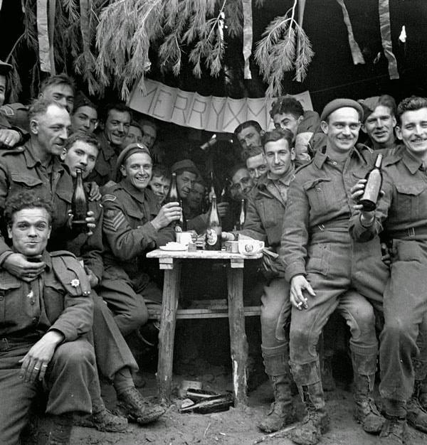 Canadian soldiers enjoying a few drinks on Christmas Day at the front, Ortona, Italy, December 25, 1943.