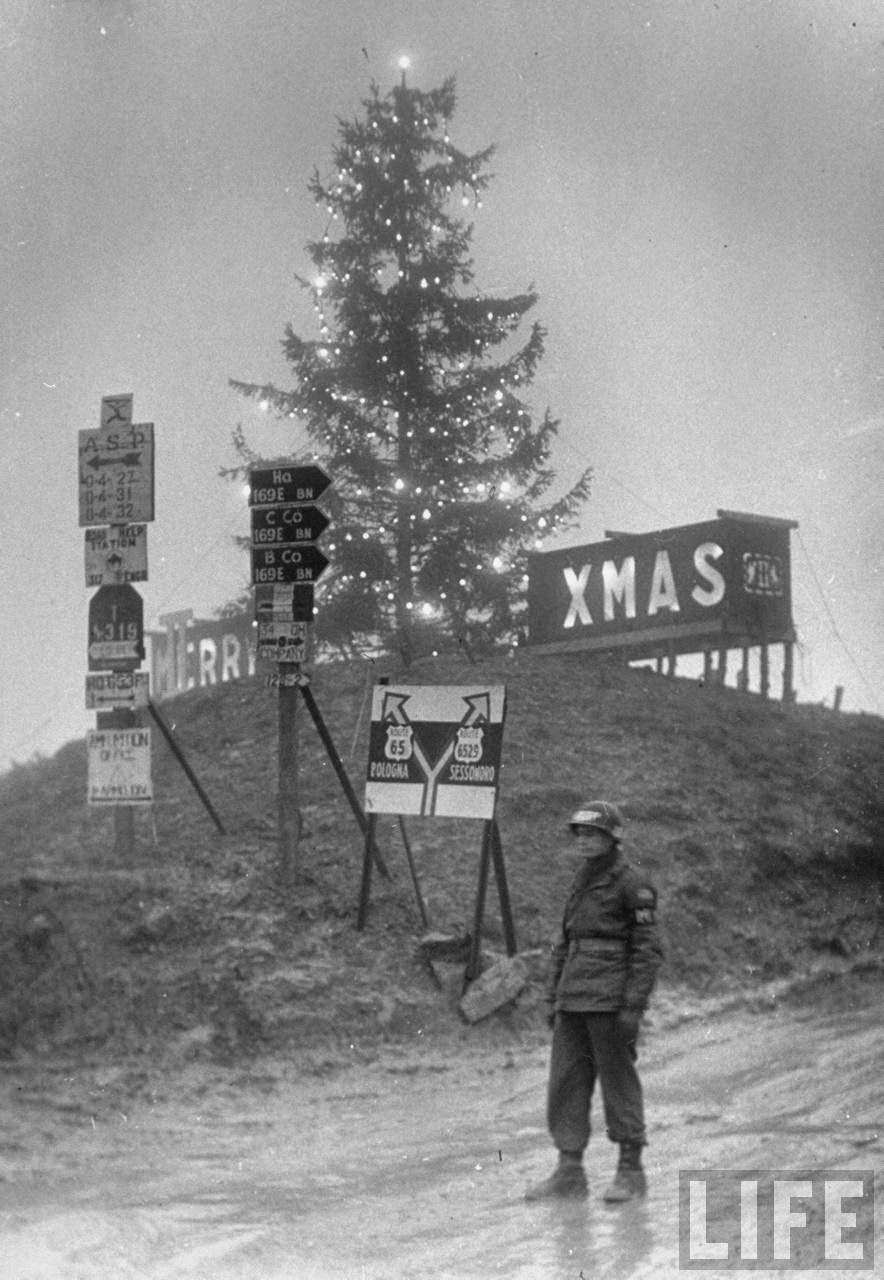 Us Fifth Army In Italy, Lighted MERRY XMAS sign behind 65-ft. Christmas tree lit up by Italian bulbs strung up by Special Services & the 53rd Signal Battalion at the top of Radicosa Pass at 2500 ft.