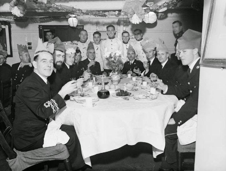 Christmas dinner in the wardroom of HMS MALAYA at Scapa Flow, 25 December 1942.