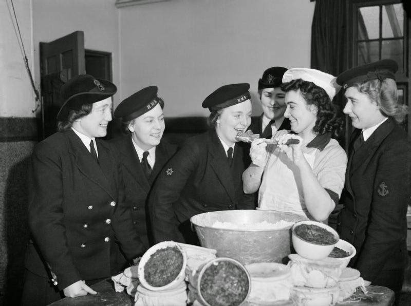 Members of the Women's Royal Naval Service sampling the Christmas pudding at Greenock in Scotland, 19 December 1942.