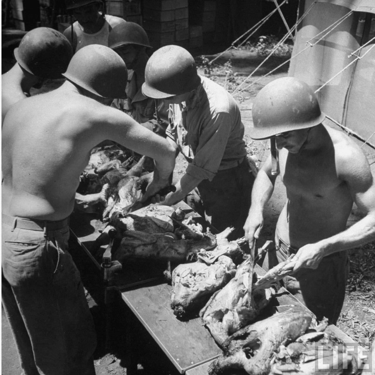 Soldiers preparing Christmas dinner, Guadalcanal, Solomon Islands, 1942.