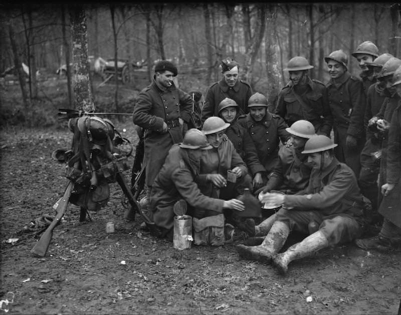 British and French troops sharing Christmas drinks in France, 1939.
