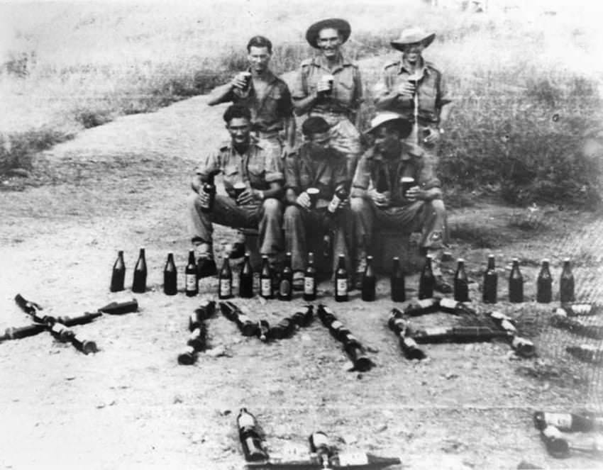 Aussie soldiers and their Christmas drinks, New Guinea, WWII.