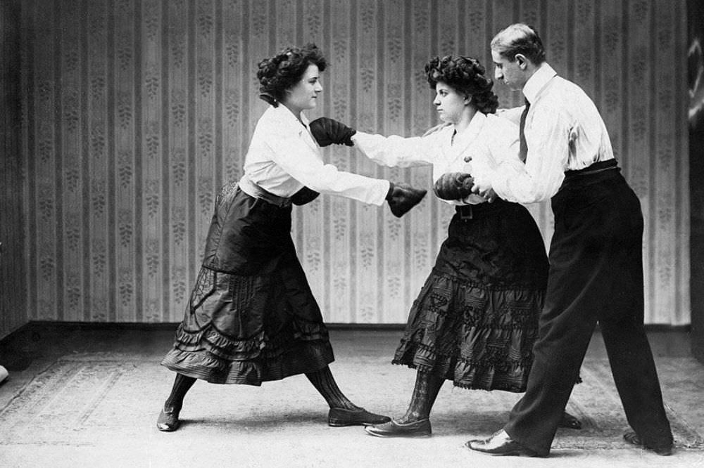 Two women train at a boxing school in Berlin, Germany, circa 1909.