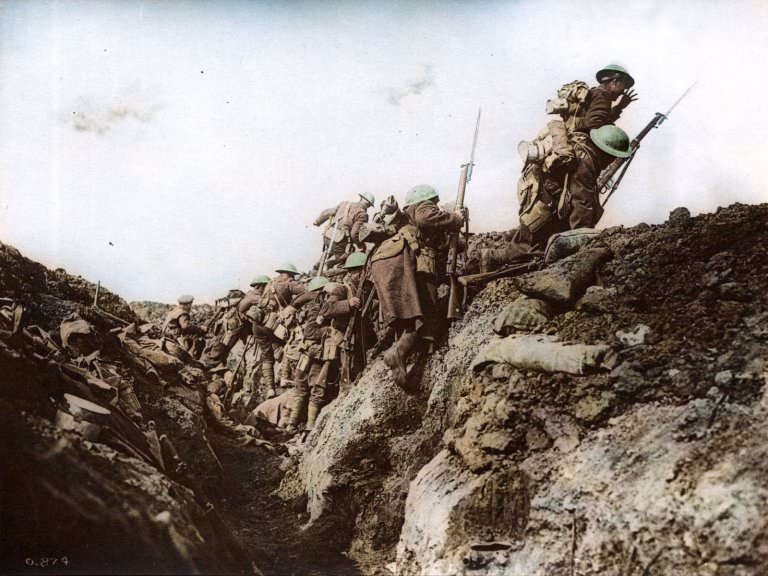 Canadian soldiers charging at the enemy during a dawn attack by going over the top of the trenches.