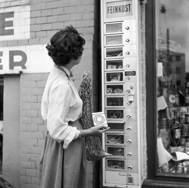A German “Feinkost” vending machine mounted on a shop’s wall, circa 1955.