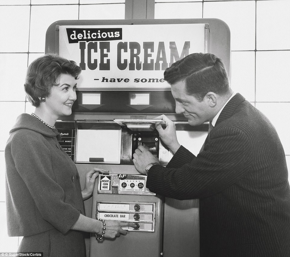 A man uses the cafeteria vending machine called 'Automat', ca. 1940s.