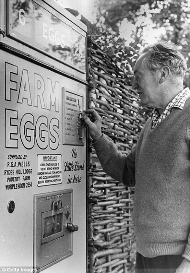 A man purchases fresh eggs from the machine in Surrey, 1963.