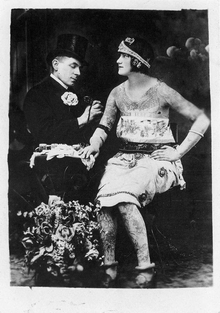 A woman getting tattooed by Charles Wagner.