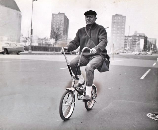 E.G. Marshall riding a bike, 1962