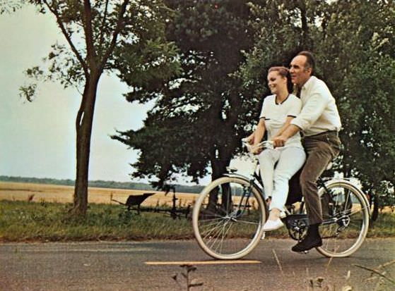 Romy Schneider and Michel Piccoli ride a bike, 1970