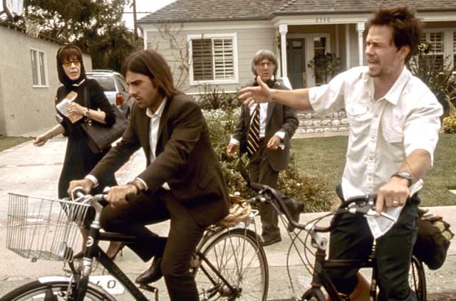 Howard Duff riding a bike
