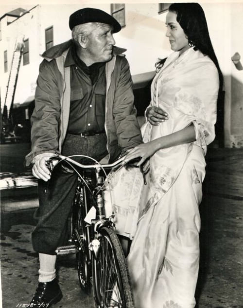 Spencer Tracy riding a bike