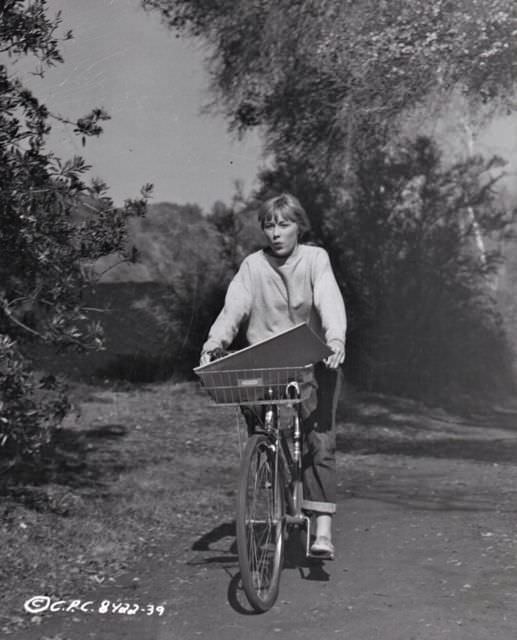 Luana Anders riding a bike