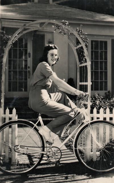 Deanna Durbin riding a bike