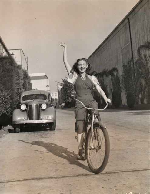 Joan Leslie riding a bike