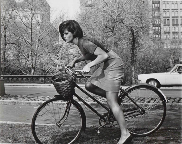 Claudia Cardinale riding a bike in Central Park.