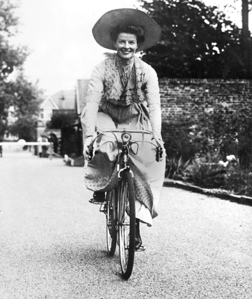 Katharine Hepburn riding a bike.