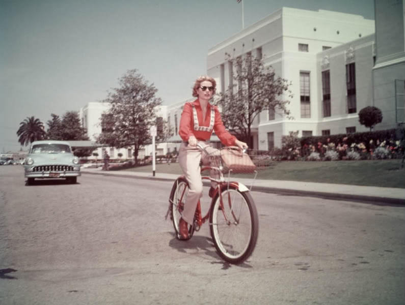 Grace Kelly riding a bike.