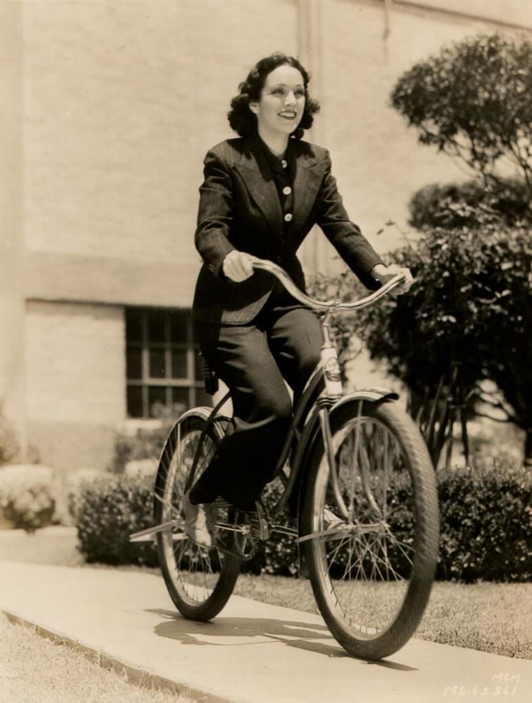 Priscilla Lawson riding a bike.