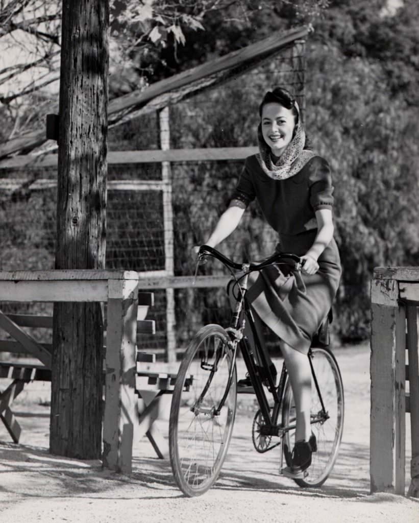 Olivia de Havilland riding a bike. Happy 99th!