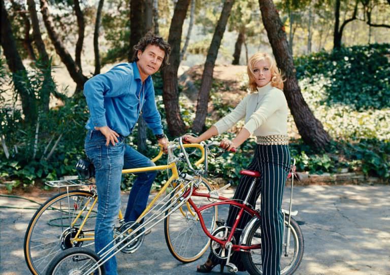 Roger Smith and Ann-Margret posing with their bikes, 1972