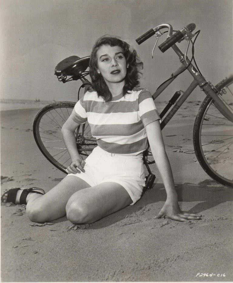 Deanna Durbin rides a bike. Colorfully.