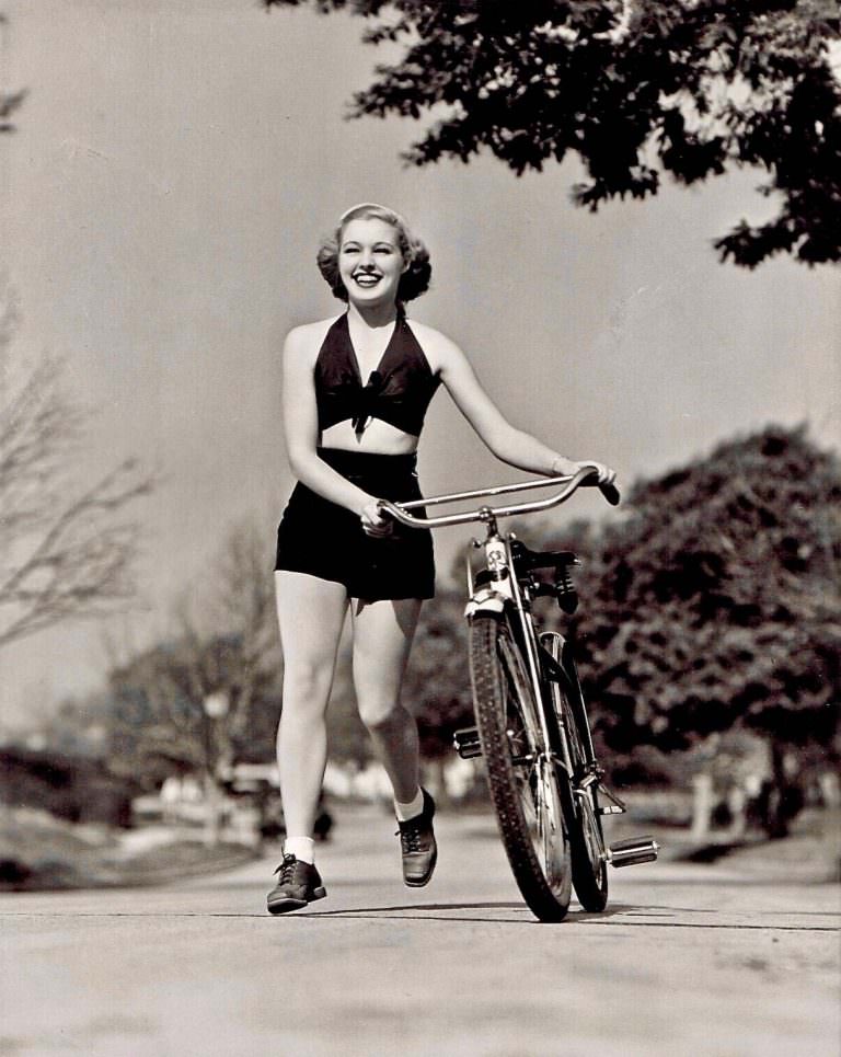 Mary Beth Hughes runs with a bike.