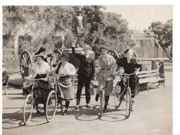 Bicycling girls” ride bikes, Lee Tracy starts pistol.