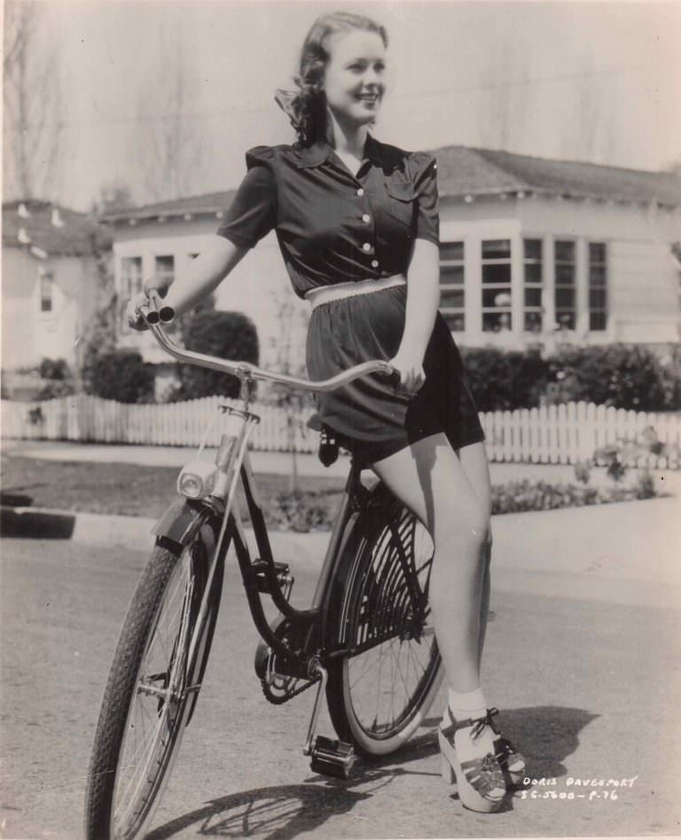 Doris Davenport models a bike.