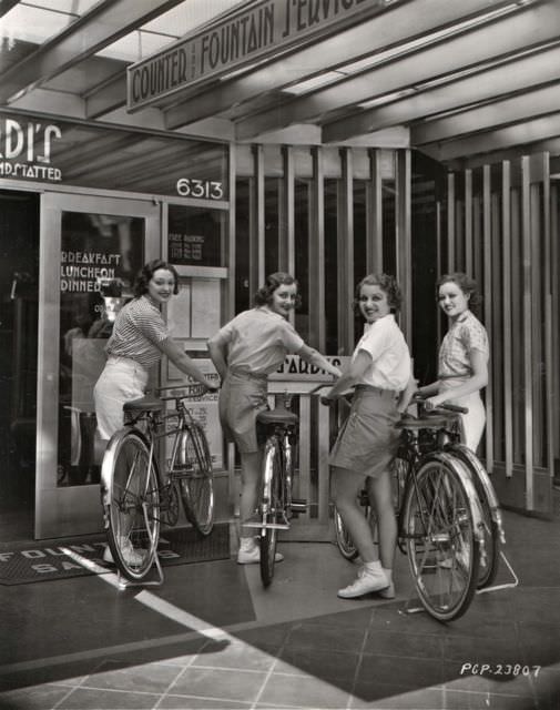 Kathleen Burke, Mari Colman, Grace Bradley and Lona Andre park bikes.