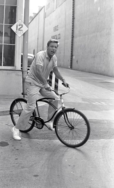 Richard Chamberlain on a bike.
