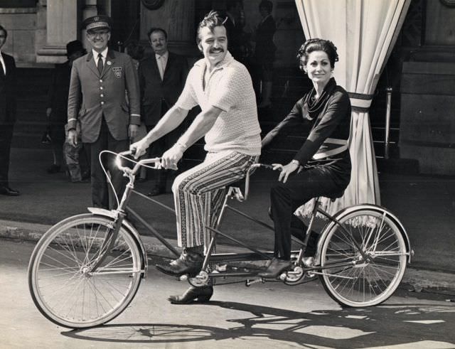 Robert Goulet and Carol Lawrence riding a bike