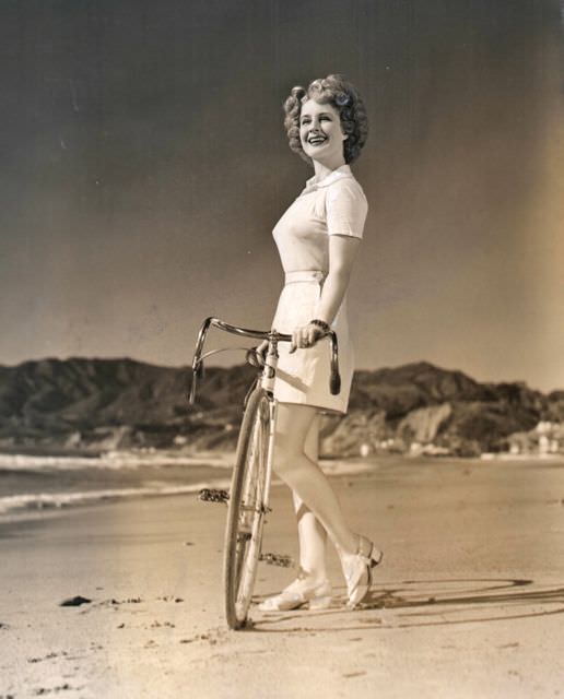 Norma Shearer coasts a bike
