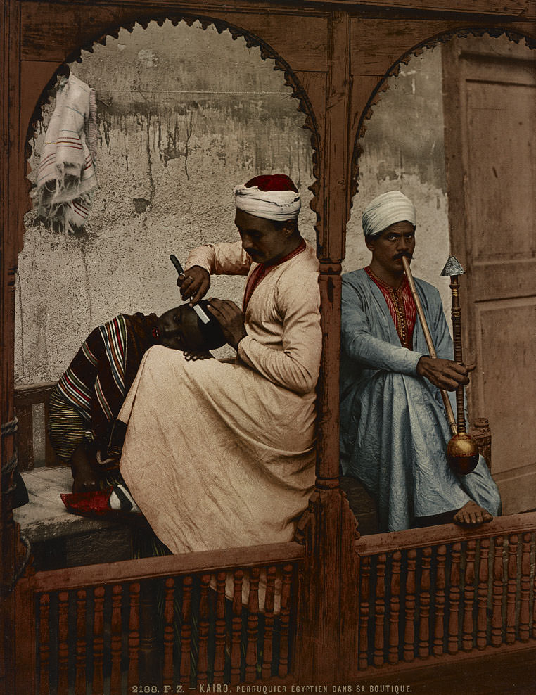 Egyptian wig maker in his shop, Cairo, 1890s