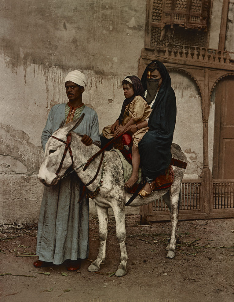 Arab woman and her donkey child, Cairo, 1890s