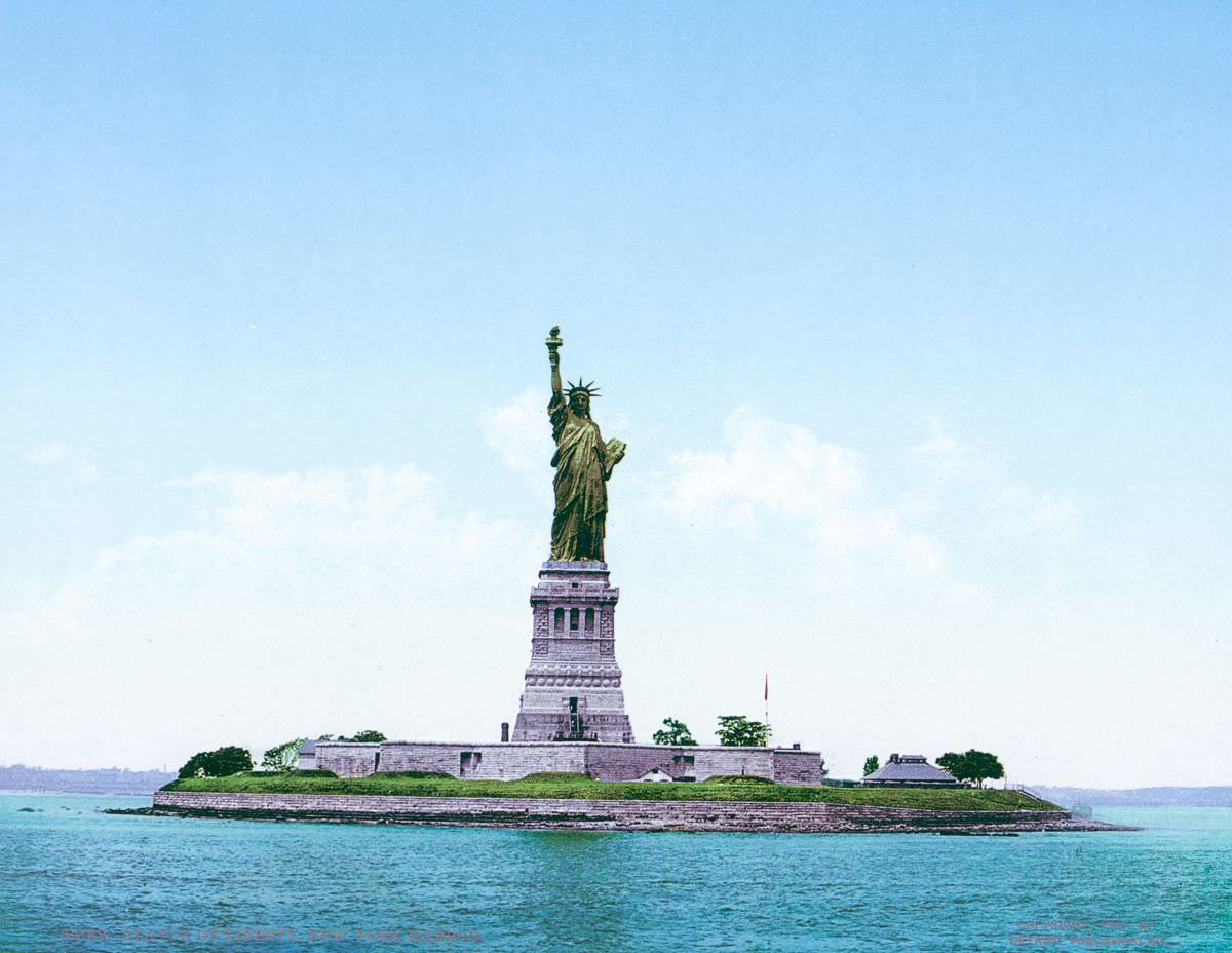 Statue of Liberty," with its original copper color still showing beneath a green patina.