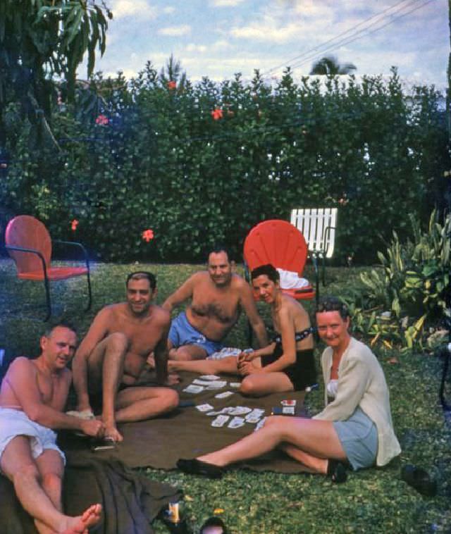 People playing cards at a backyard party in Miami, circa 1955