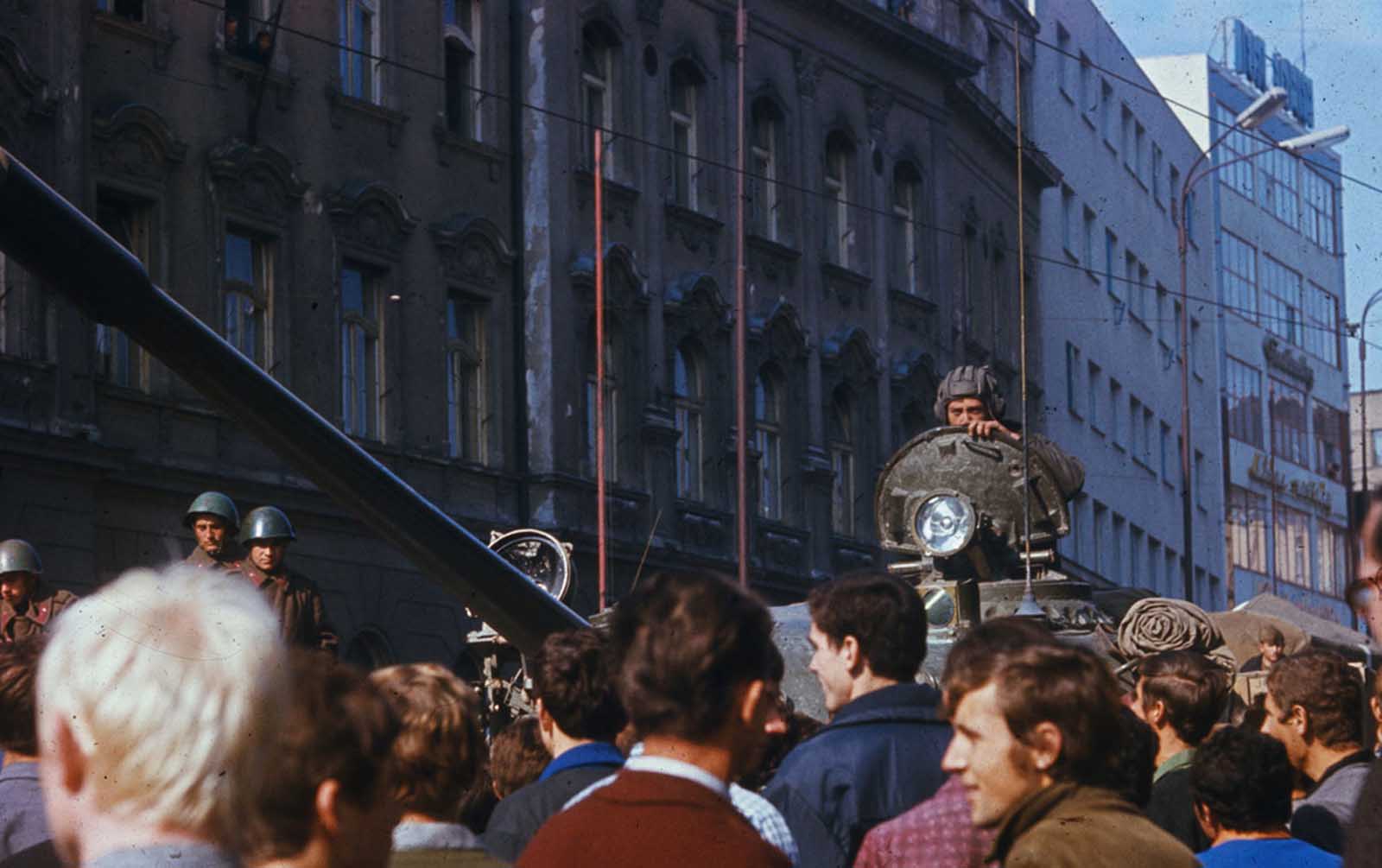 Czechs jeer a Soviet tank in downtown Prague.