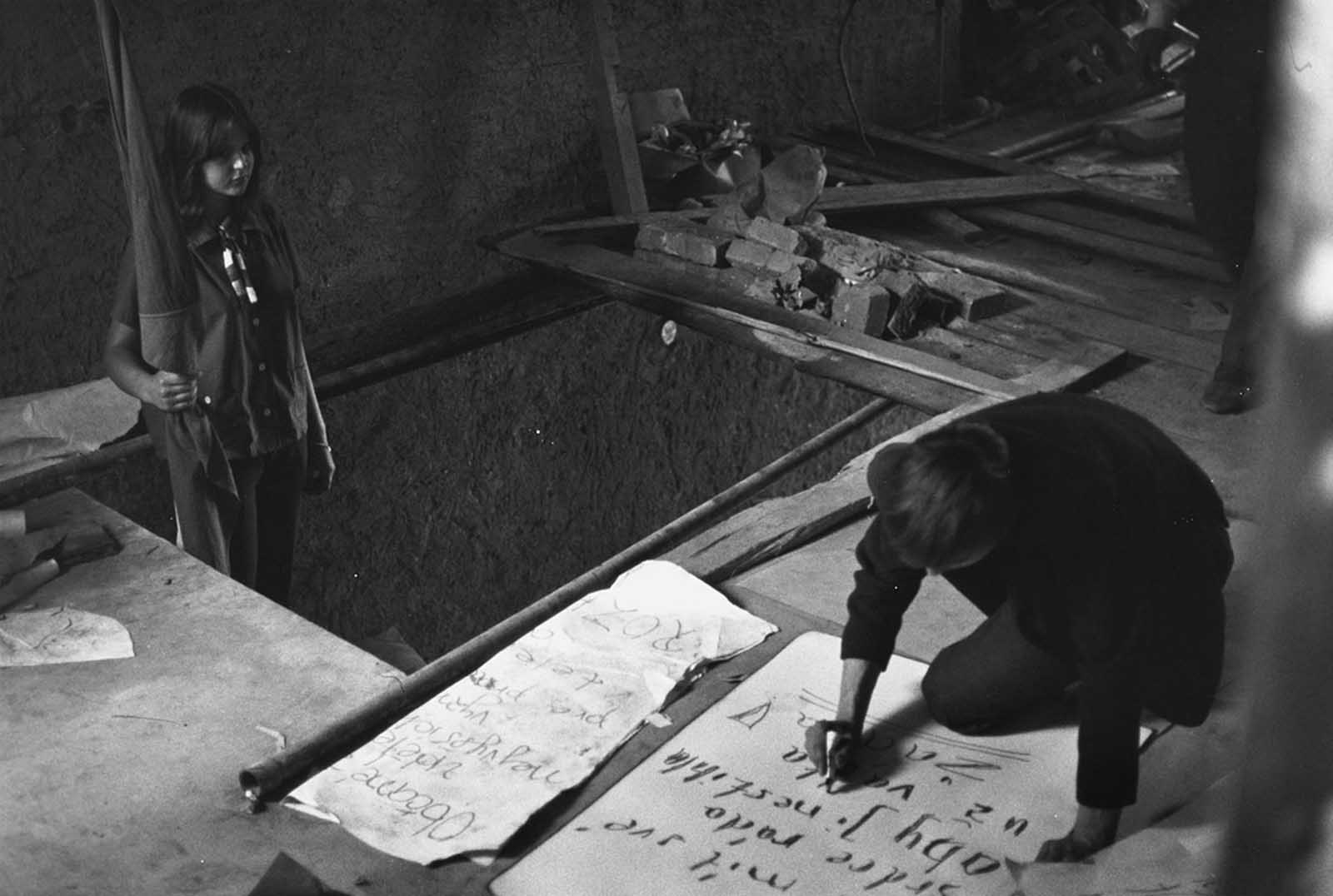 Students in the underground movement make anti-Russian posters on September 3, 1968, in Prague.