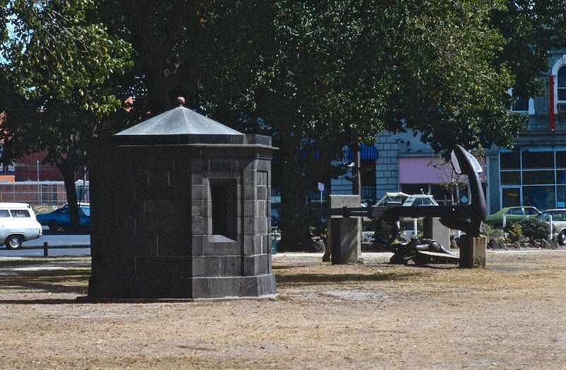 Unknown grey stone building and large anchor, Melbourne