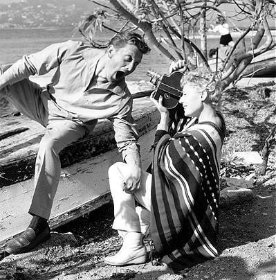 Actress Tilda Thamar filming Kirk Douglas pullling faces during the International Cannes Film Festival, 20th April 1953.